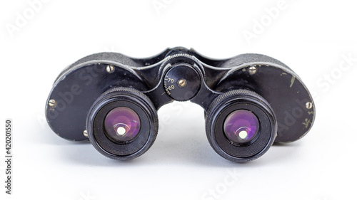 Old military binoculars close-up. Soft focus.