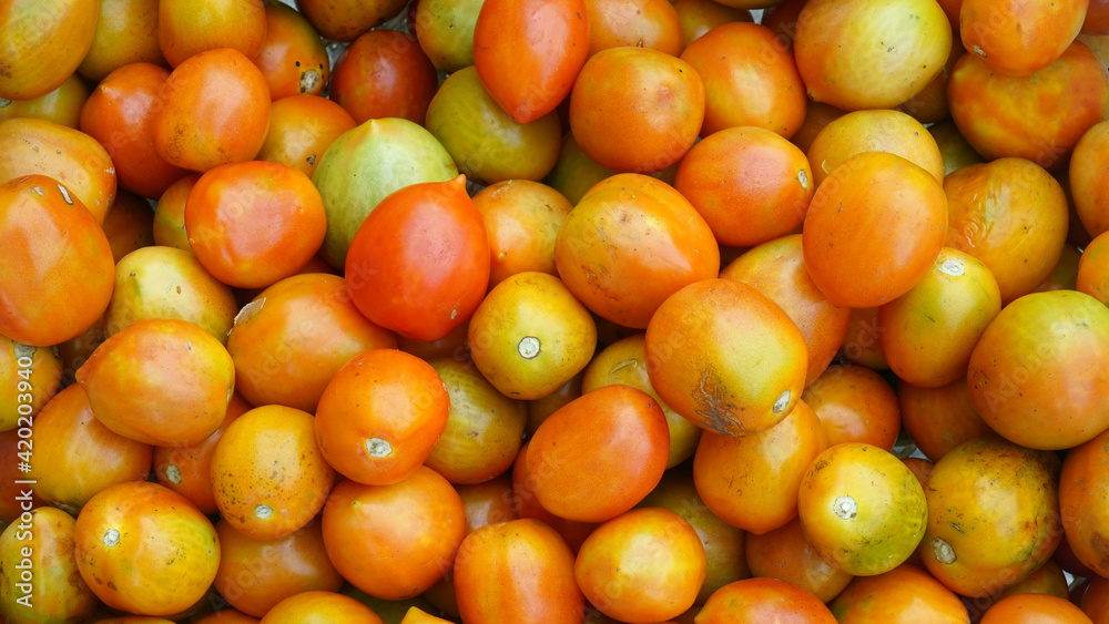 Lots of fresh orange tomatoes. Good for the background