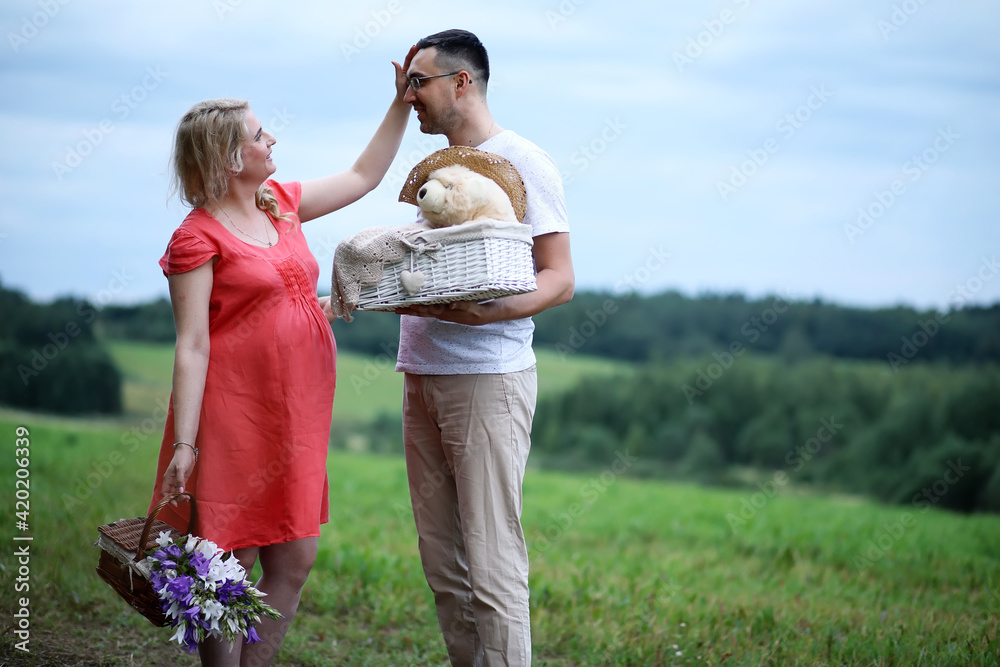 Pregnant girl with big belly and young man outdoor Pregnant girl with big belly and young man outdoor
