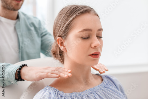 Reiki master working with p...