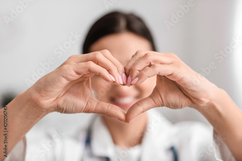 Cardiologist making heart w...