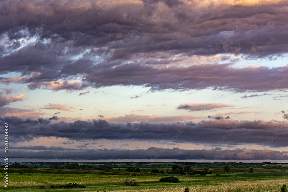 Rural landscape with clouds at sunset 