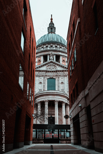 London UK February 2021 View of the Saint Pauls cathedral, rising high above the nearby buildings. Streets and shops closed during UKs national covid lockdown photo