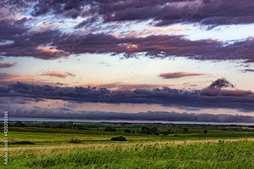 Rural landscape with clouds at sunset 