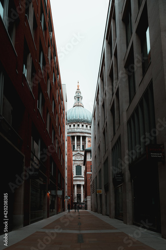London UK February 2021 View of the Saint Pauls cathedral, rising high above the nearby buildings. Streets and shops closed during UKs national covid lockdown © Antonio