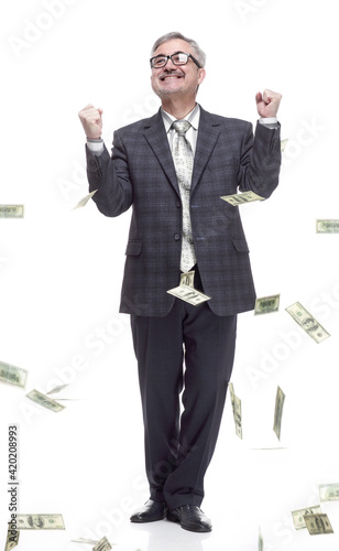 happy man standing in the rain of money. isolated on a white