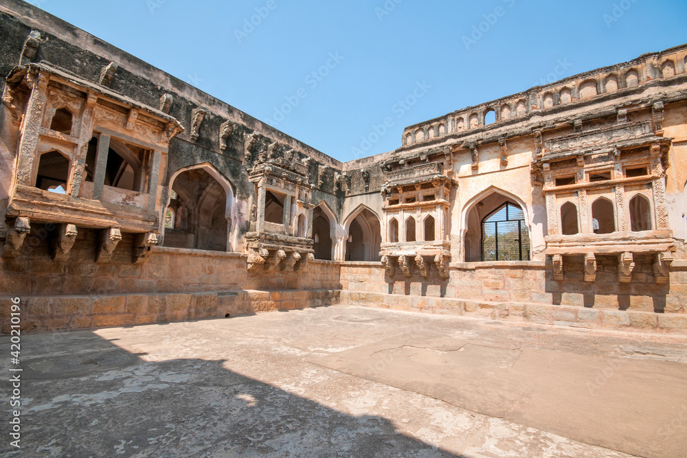historic bathing chamber used by the king & his wives, with an outdoor pool at hampi karnataka india