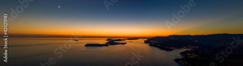 Aerial panorama drone shot of sunset horizon in Adriatic islands in Dubrovnik in Croatia summer