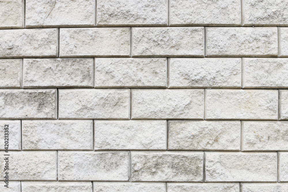 A wall made of gray bricks.