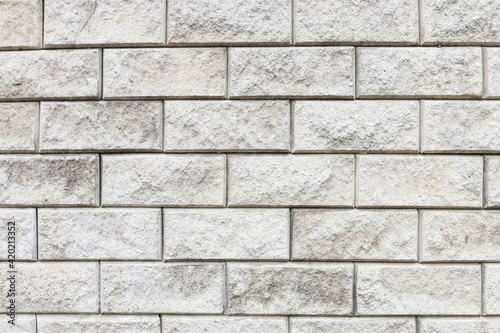 A wall made of gray bricks.