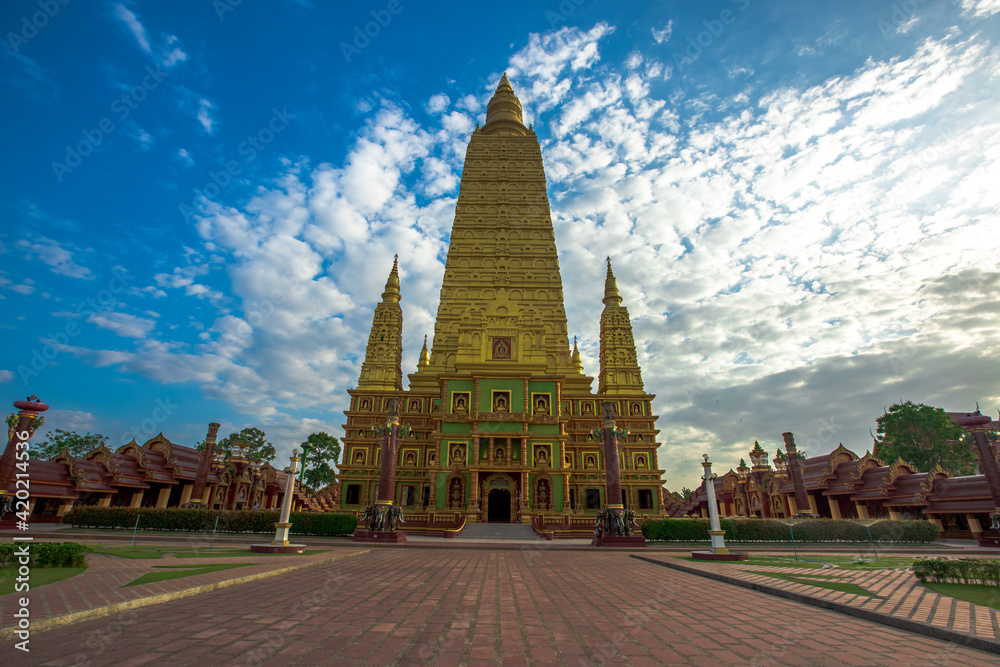 Fototapeta premium The beautiful sculpture background of, Wat Bang Thong, surrounded by trees, has a large area, is a religious tourist attraction in Krabi, with tourists always visiting, Thailand
