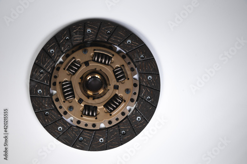 Clutch disc of a manual transmission of a passenger car on a gray background