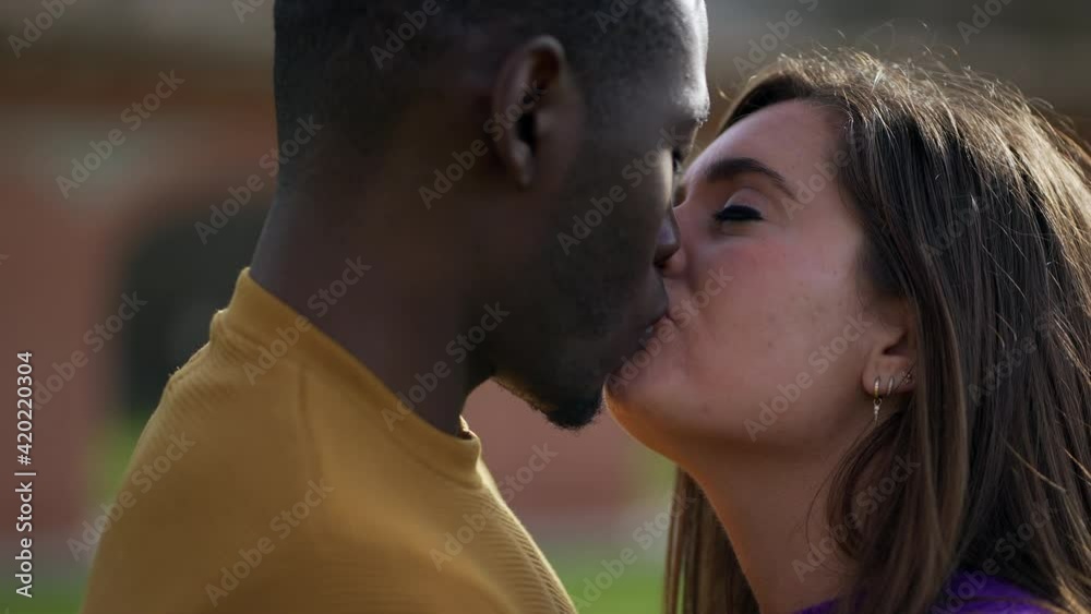 Diversity concept. Black man kissing girlfriend Diversity concept. Black man kissing girlfriend