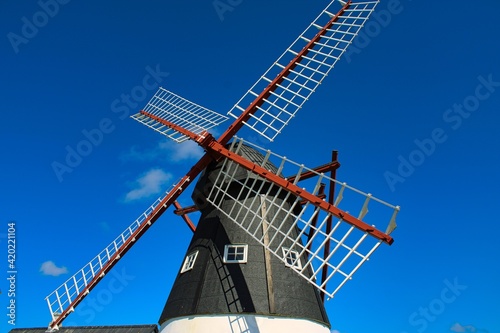 Wind mill in front of a beautiful blue sky 