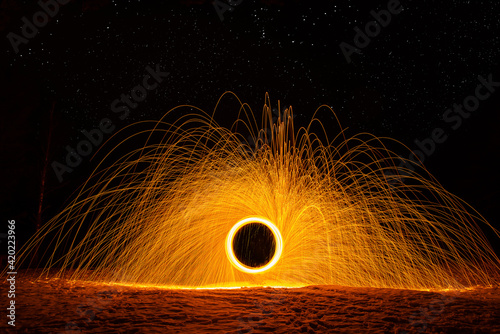 Ring of fire sparks, firework at night, long exposure