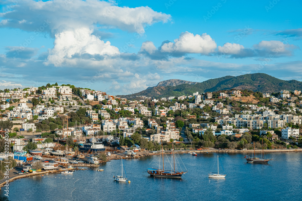 Bodrum and traditional white greek houses next to Aegean Sea in Turkey - October, 2020: Bodrum is one of the most preferred holiday destination for tourist. 