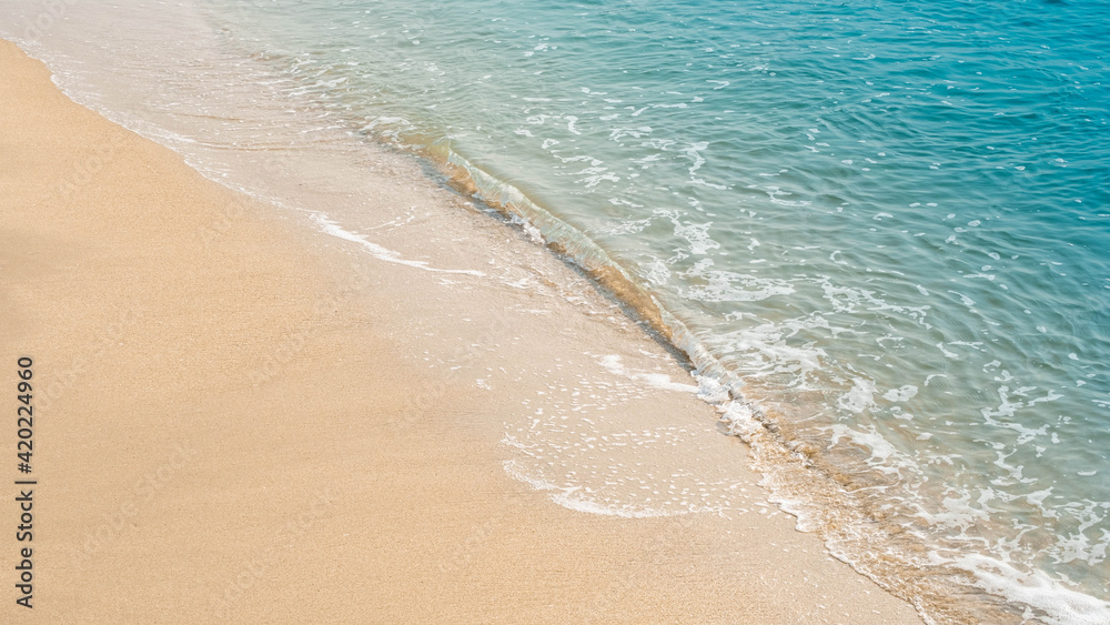 wave of blue ocean on sandy beach. texture Background.