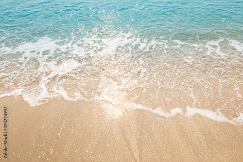 Blue ocean waves Sunlight Reflection Sand Beach background