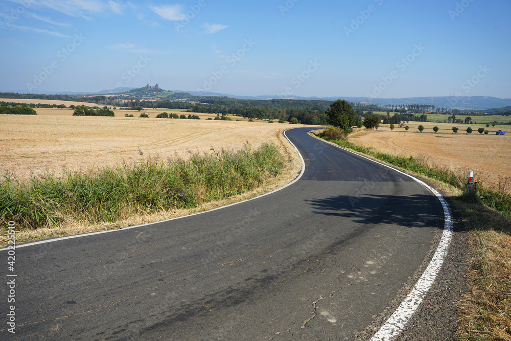 Winding road in Bohemian Paradise landscape with Trosky Castle and natural reserve, travel concept Winding road in Bohemian Paradise landscape with Trosky Castle and natural reserve, travel concept