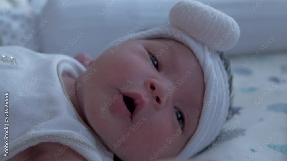 Innocent Face Of A Newborn Asian Baby Girl Lying In Bed. close up.4k 60p. Innocent Face Of A Newborn Asian Baby Girl Lying In Bed. close up.4k 60p.