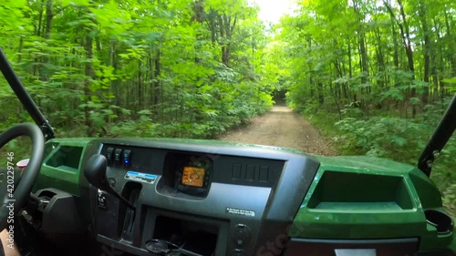 utv side by side pov passenger seat driving in forest photo