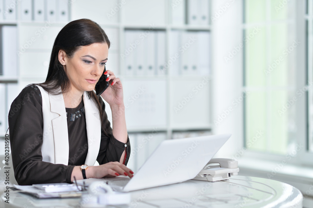 young brunette woman working at office young brunette woman working at office