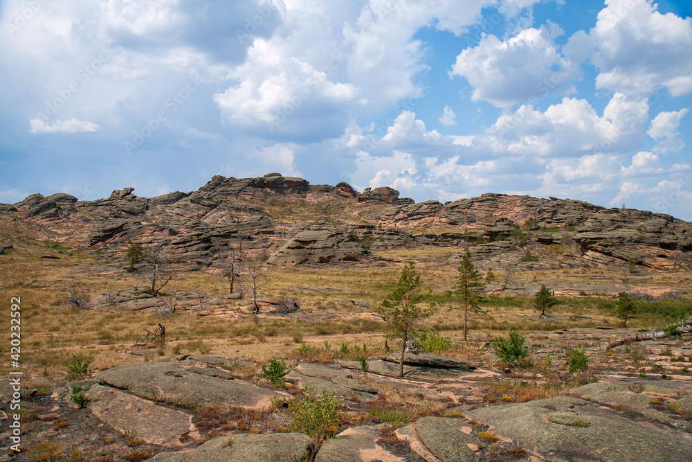 Rocky terrain and some woodland in the Bayanaul National Park, Kazakh Uplands. Rocky terrain and some woodland in the Bayanaul National Park, Kazakh Uplands.