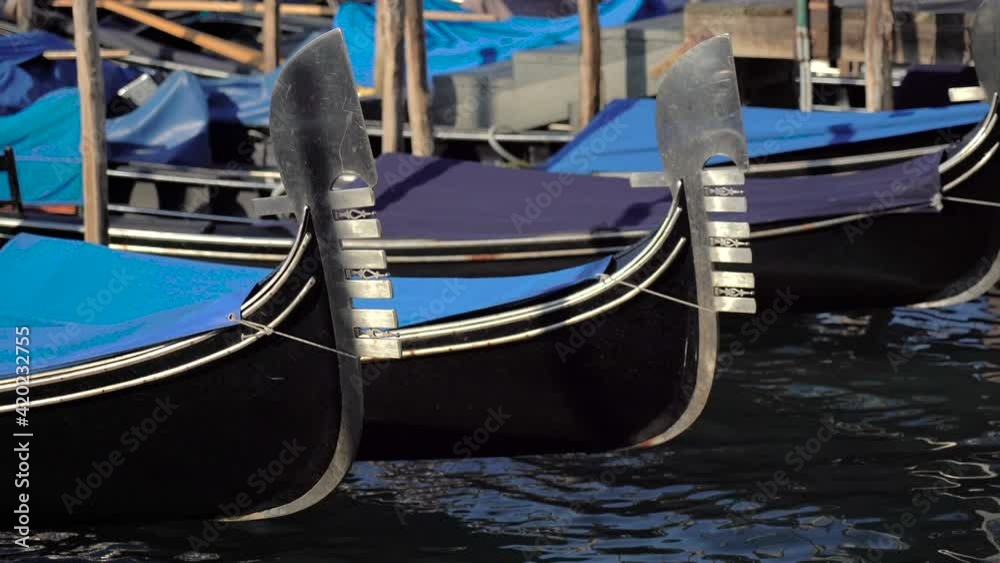 Gondolas on a summer day in Venice floating on the lagoon near St. Mark's square. Gondolas on a summer day in Venice floating on the lagoon near St. Mark's square.