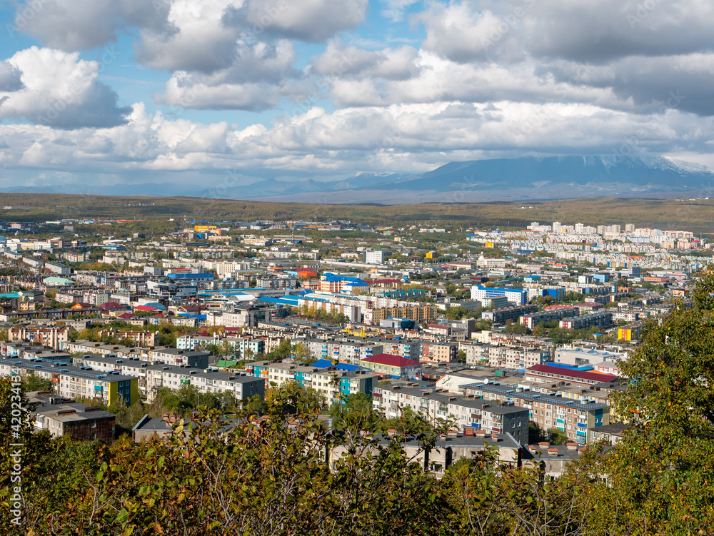 View of the city of Petropavlovsk-Kamchatsky from Mishennaya Sopka. Magnificent views of the city and home volcanoes from above. Kamchatka Peninsula, Russia.
