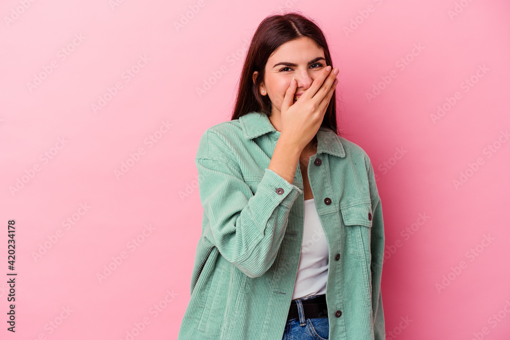 Young caucasian woman isolated on pink background laughing happy, carefree, natural emotion. Young caucasian woman isolated on pink background laughing happy, carefree, natural emotion.