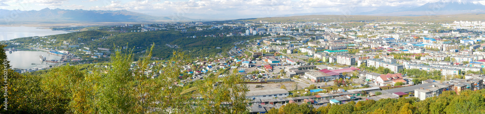 Panorama view of the city of Petropavlovsk-Kamchatsky and the sea bay from Mishennaya Sopka. Magnificent views of the city and home volcanoes from above. Kamchatka Peninsula, Russia.