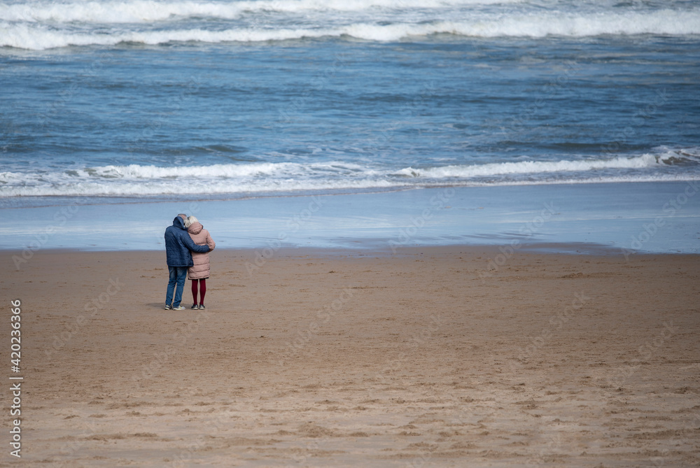 retired couple looking at the sea