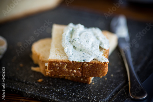 homemade salted curd spread with herbs and garlic
