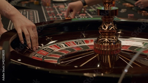 Roulette players place their bets
