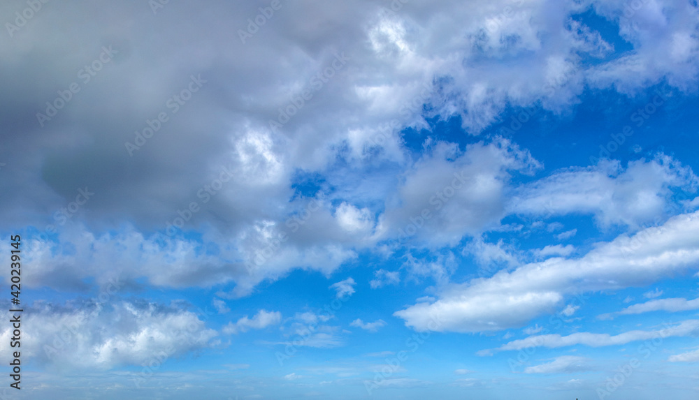 white clouds on the blue sky
