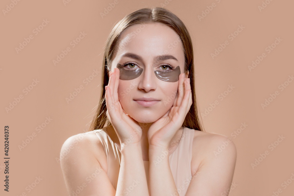 Eye patch, Beautiful Woman With Natural Makeup And Black Hydro Gel Eye Patches On Facial Skin Eye patch, Beautiful Woman With Natural Makeup And Black Hydro Gel Eye Patches On Facial Skin