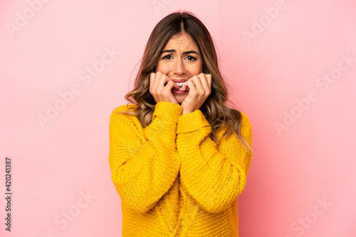 Young caucasian woman isolated biting fingernails, nervous and very anxious.