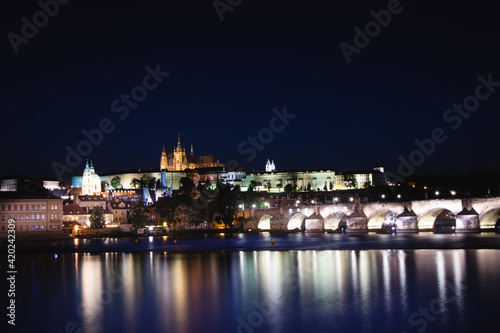 Night view of the old town of Prague with Prague Castle and the most popular tourist attraction with the Prague Bridge during the coronavirus pandemic. Famous stone bridge in capital of Czech republic