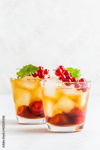 Summer party cocktail  berry iced tea in glasses. Space fot text.