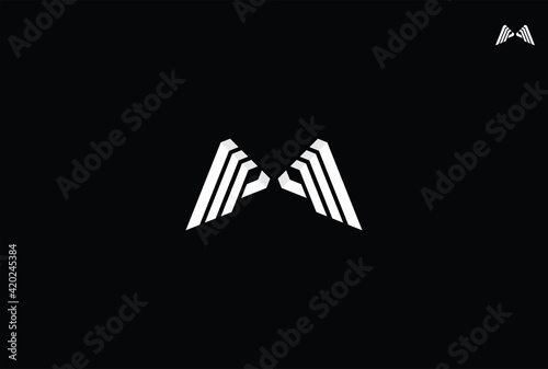 Bold M and modern eagle wing design with 3d curves forming the letter m, this unique logo is suitable for fashion, boutique, clothing or branding. photo
