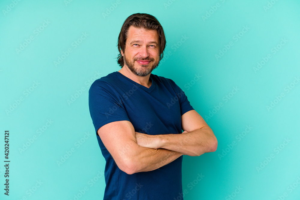 Middle age man standing isolated on blue background Middle age man standing isolated on blue background