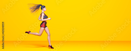 Woman athlete runs.