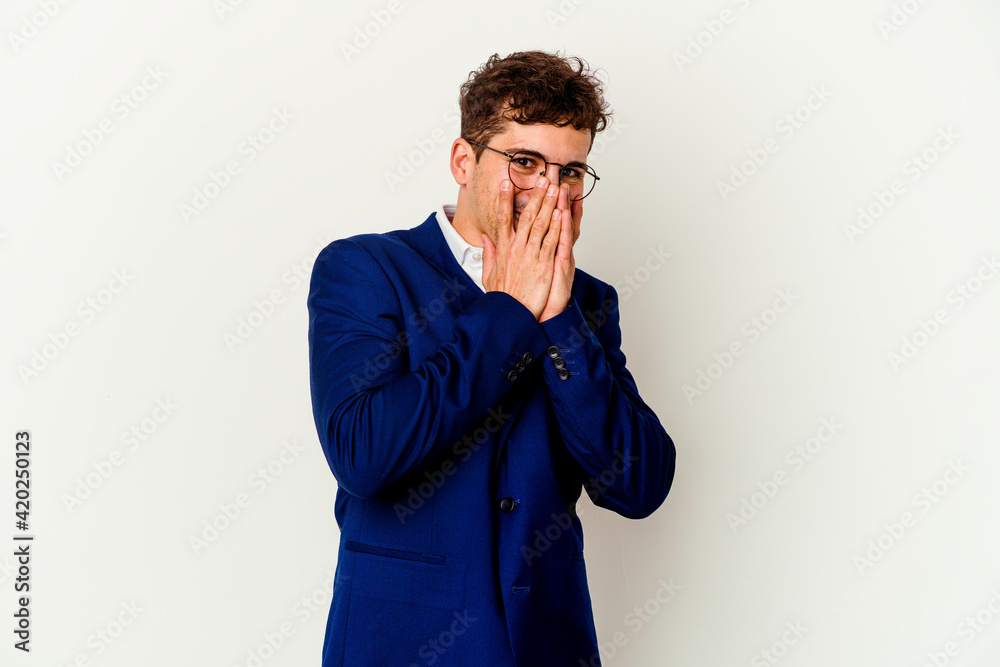 Young business caucasian man isolated on white background laughing about something, covering mouth with hands. Young business caucasian man isolated on white background laughing about something, covering mouth with hands.