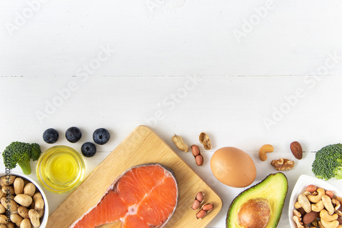 Top view of keto or ketogenic diet on white wooden background, low carb eating with high protein and good fat source