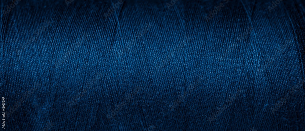 blue cotton threads with visible details. background - obrazy, fototapety, plakaty 