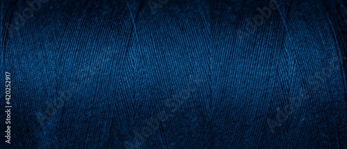 Obraz na plátne blue cotton threads with visible details. background