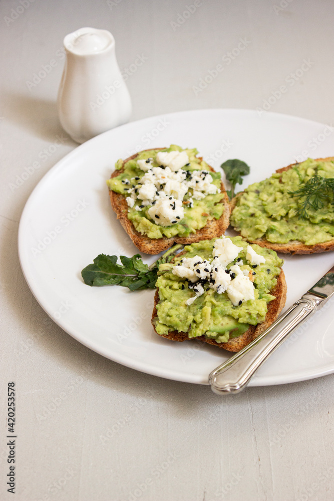 Avocado toast. Sliced bread with avocado. Avocado toast. Sliced bread with avocado.