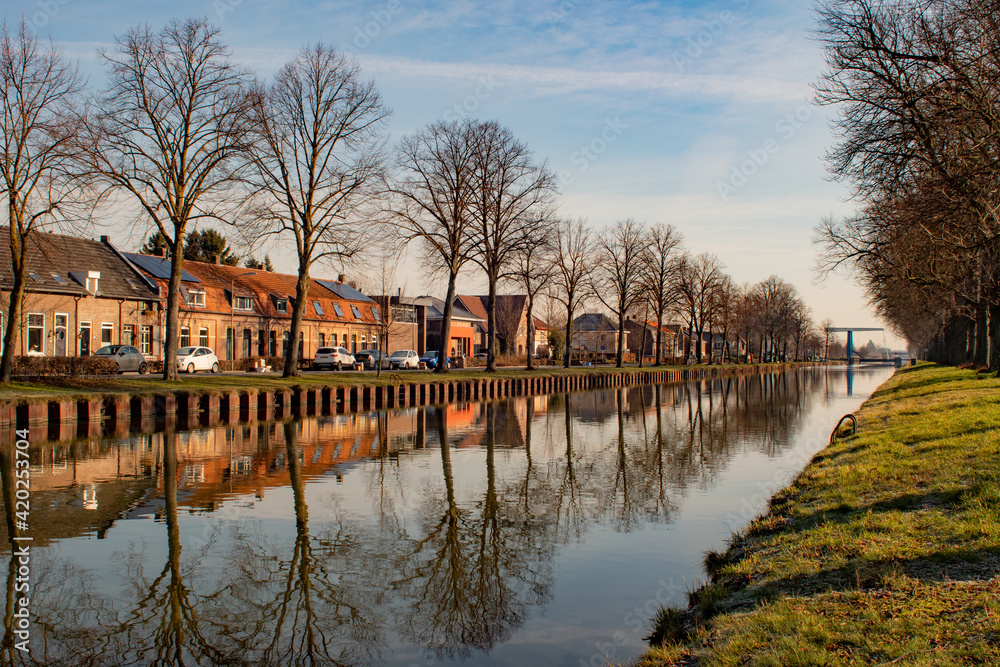 Scenery with canal the Zuid-Willemsvaart in Weert the Netherlands and a blue sky Scenery with canal the Zuid-Willemsvaart in Weert the Netherlands and a blue sky