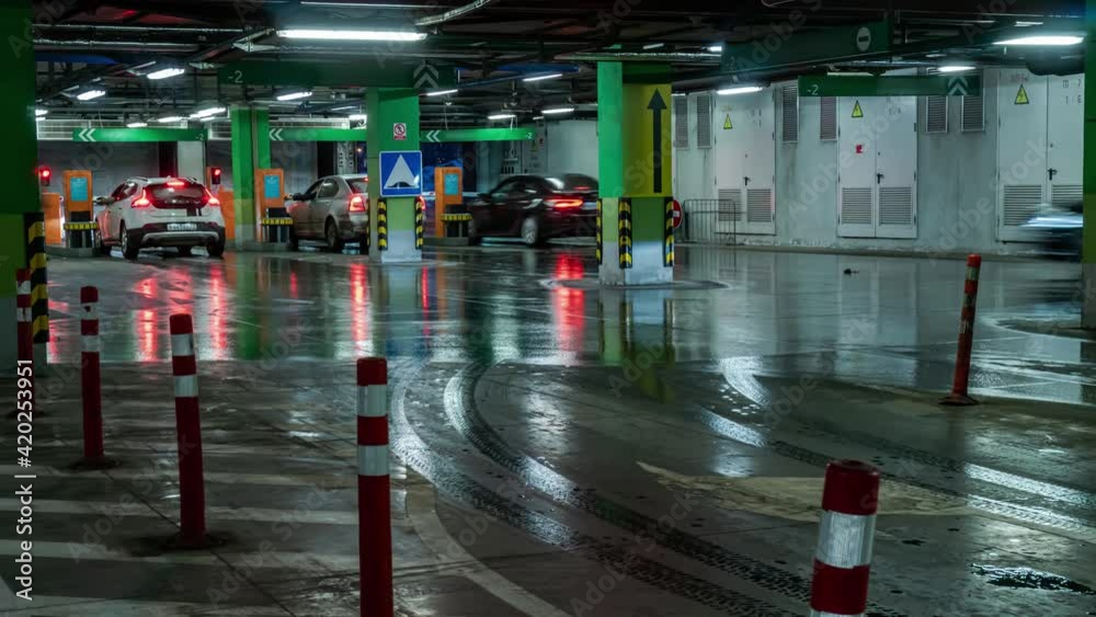 Entry and exit of cars from  underground Parking lot of shopping mall, time lapse
