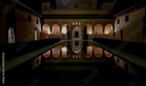 Alhambra at night inside the Patio de los Arrayanes
in granada, Spain photo
